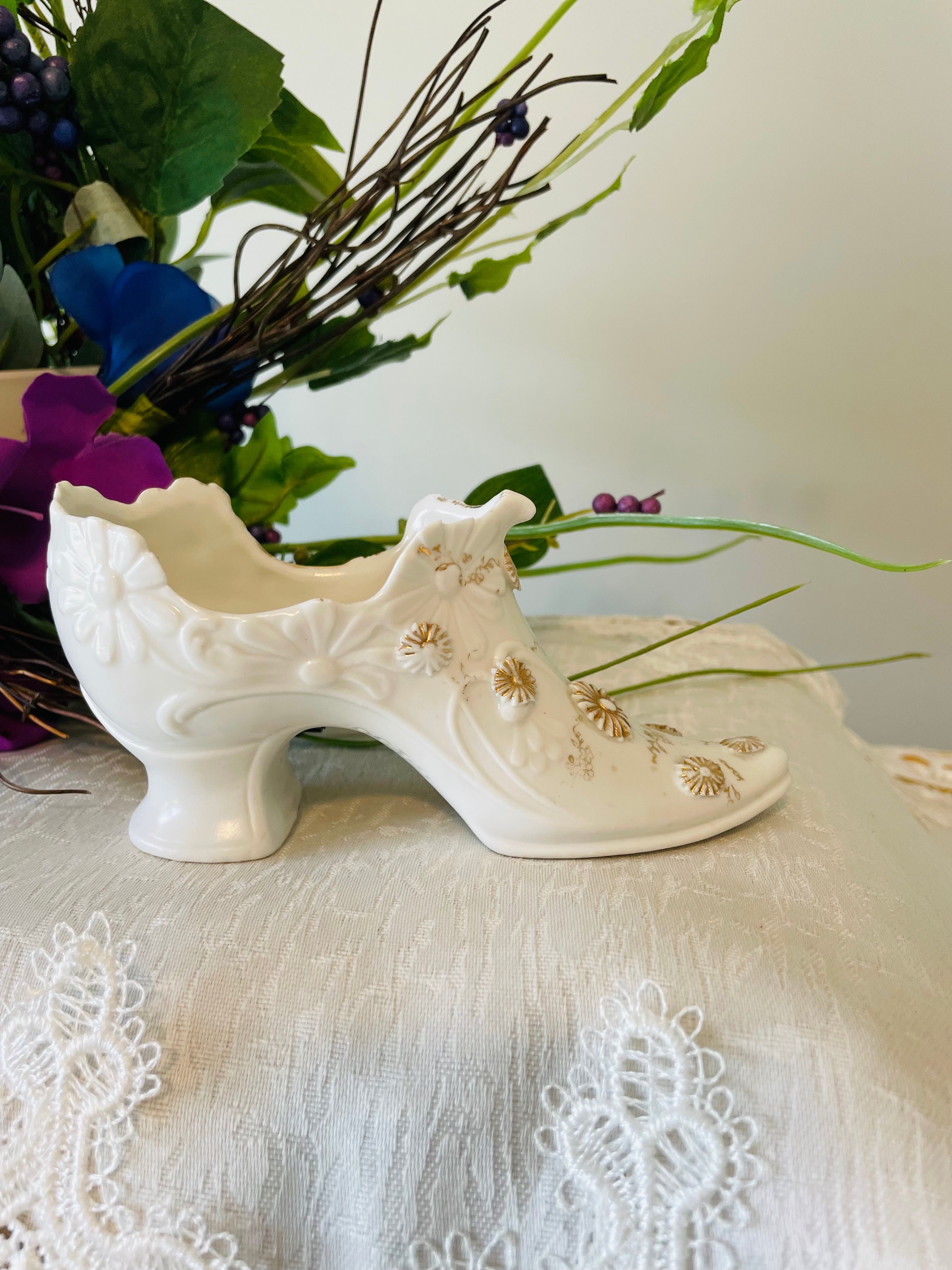 Victorian porcelain shoe with embossed floral and gilded accents
