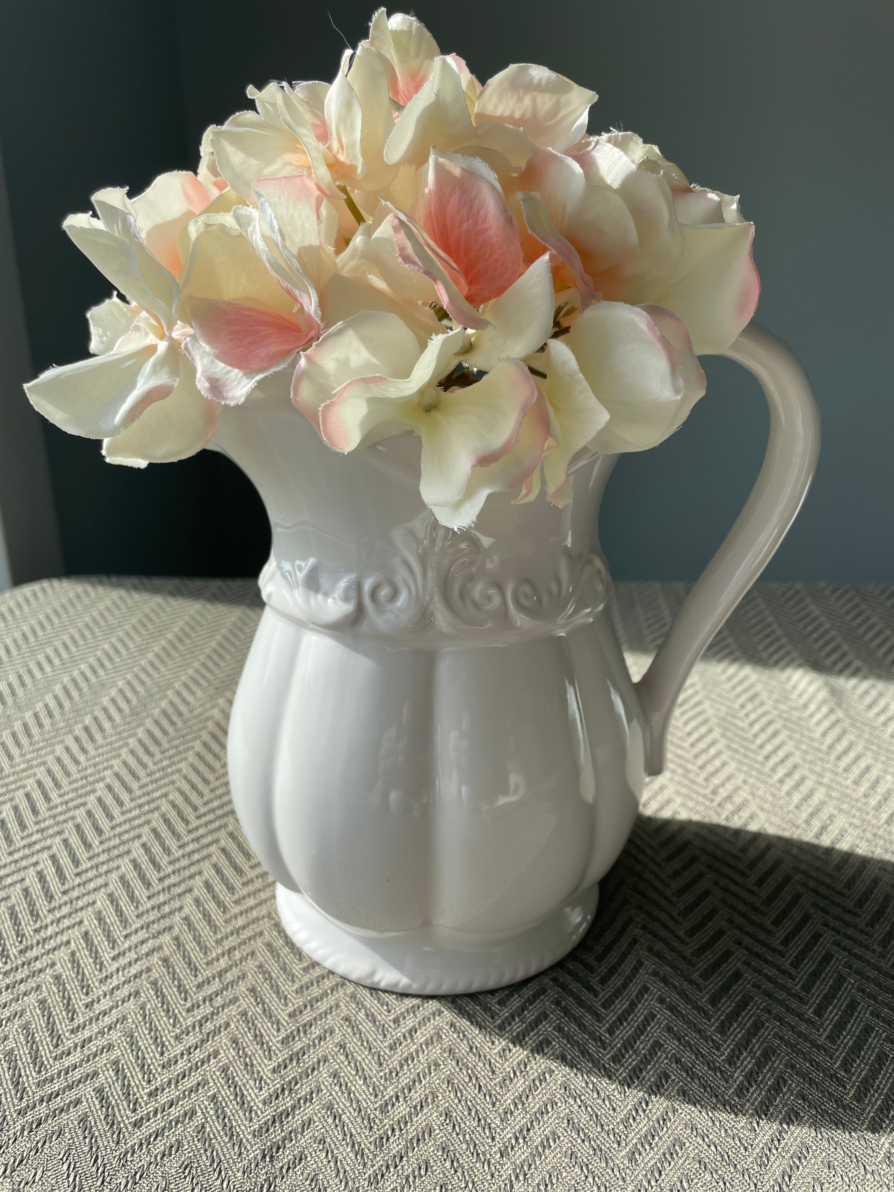 Pfaltzgraff Filigree pattern stoneware pitcher with embossed scrolls