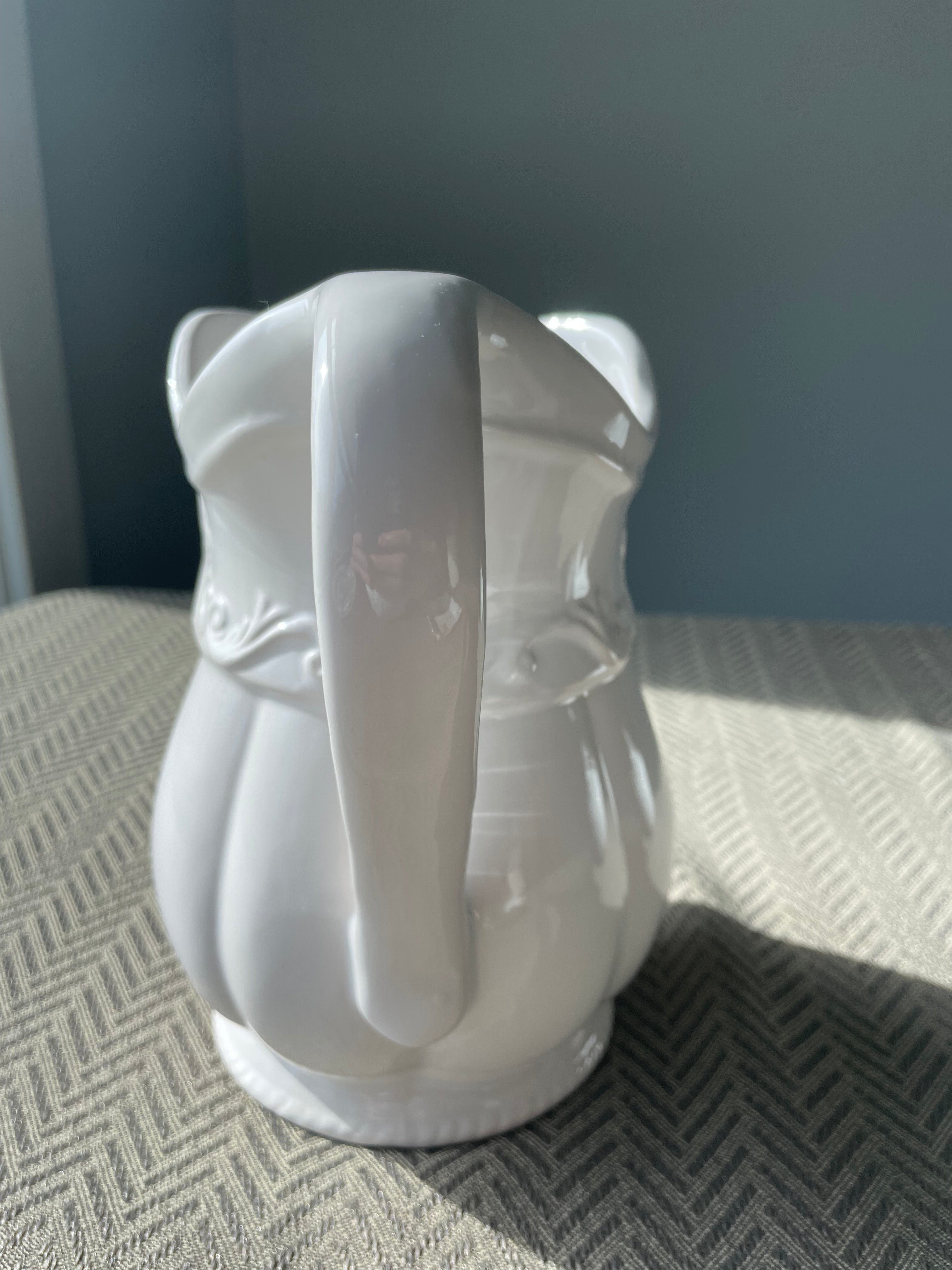 Pfaltzgraff Filigree pattern stoneware pitcher with embossed scrolls