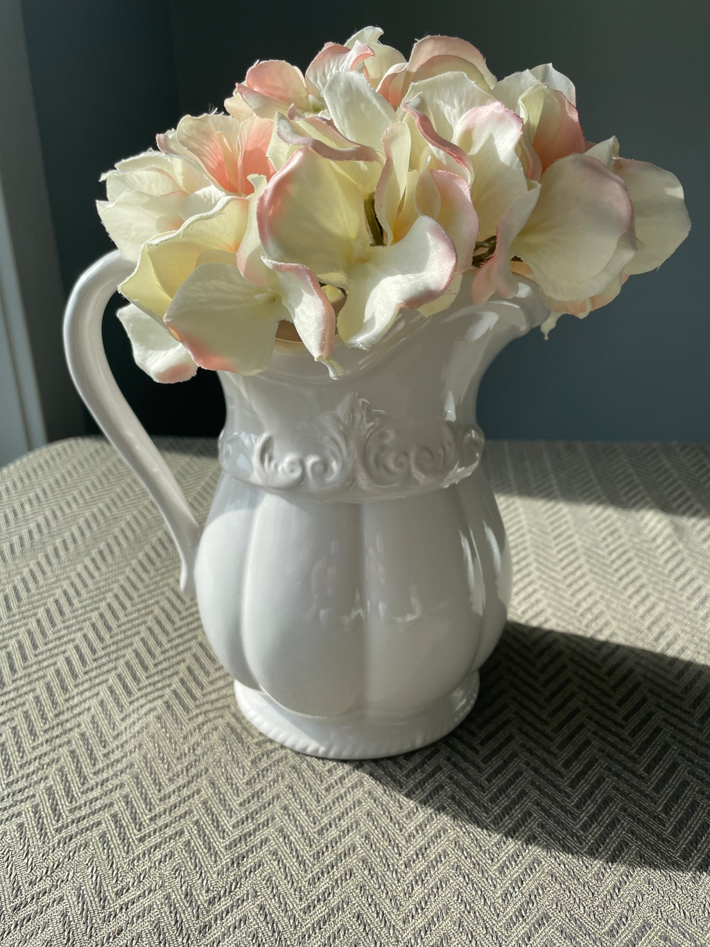 Pfaltzgraff Filigree pattern stoneware pitcher with embossed scrolls