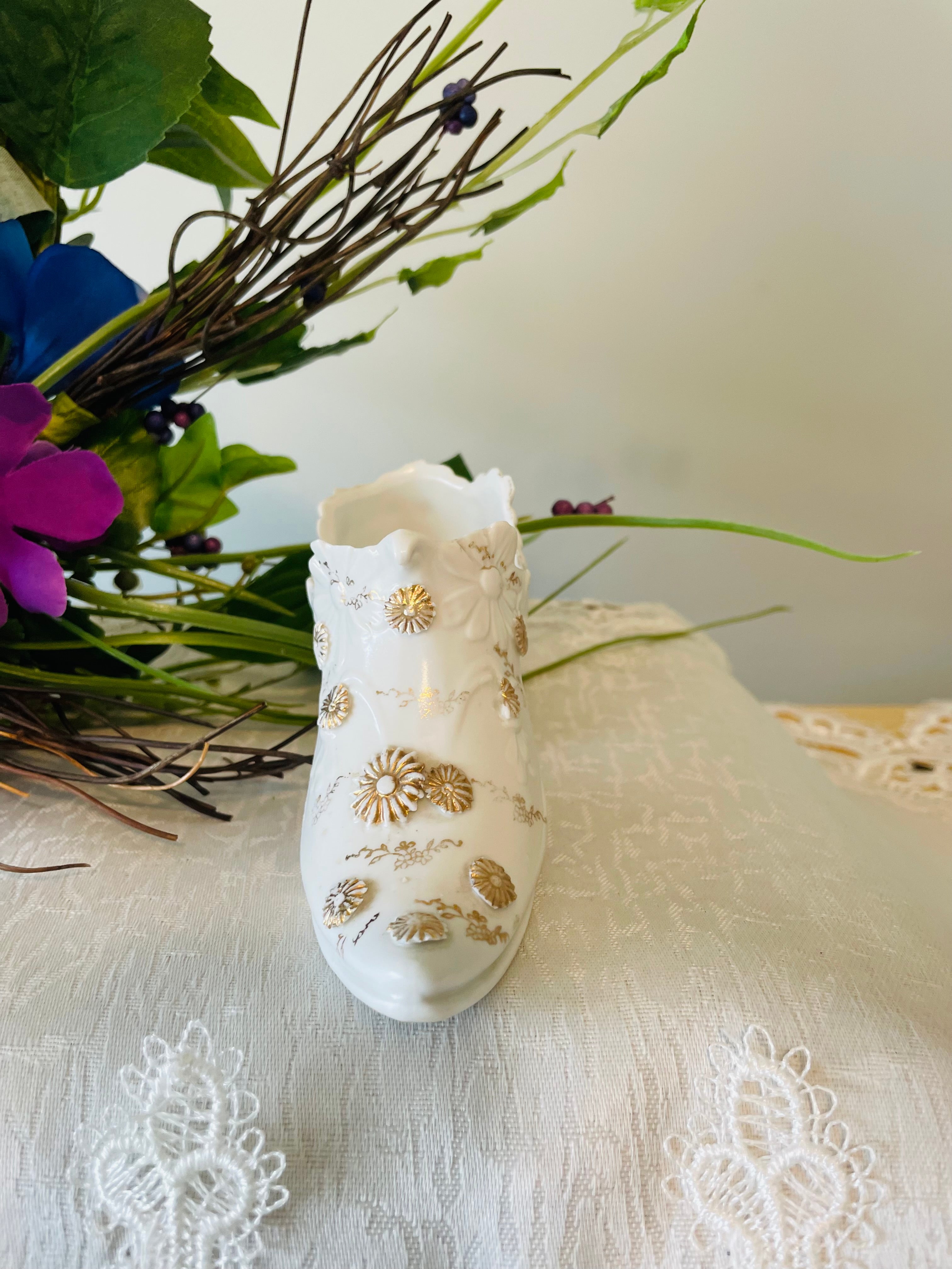 Victorian porcelain shoe with embossed floral and gilded accents