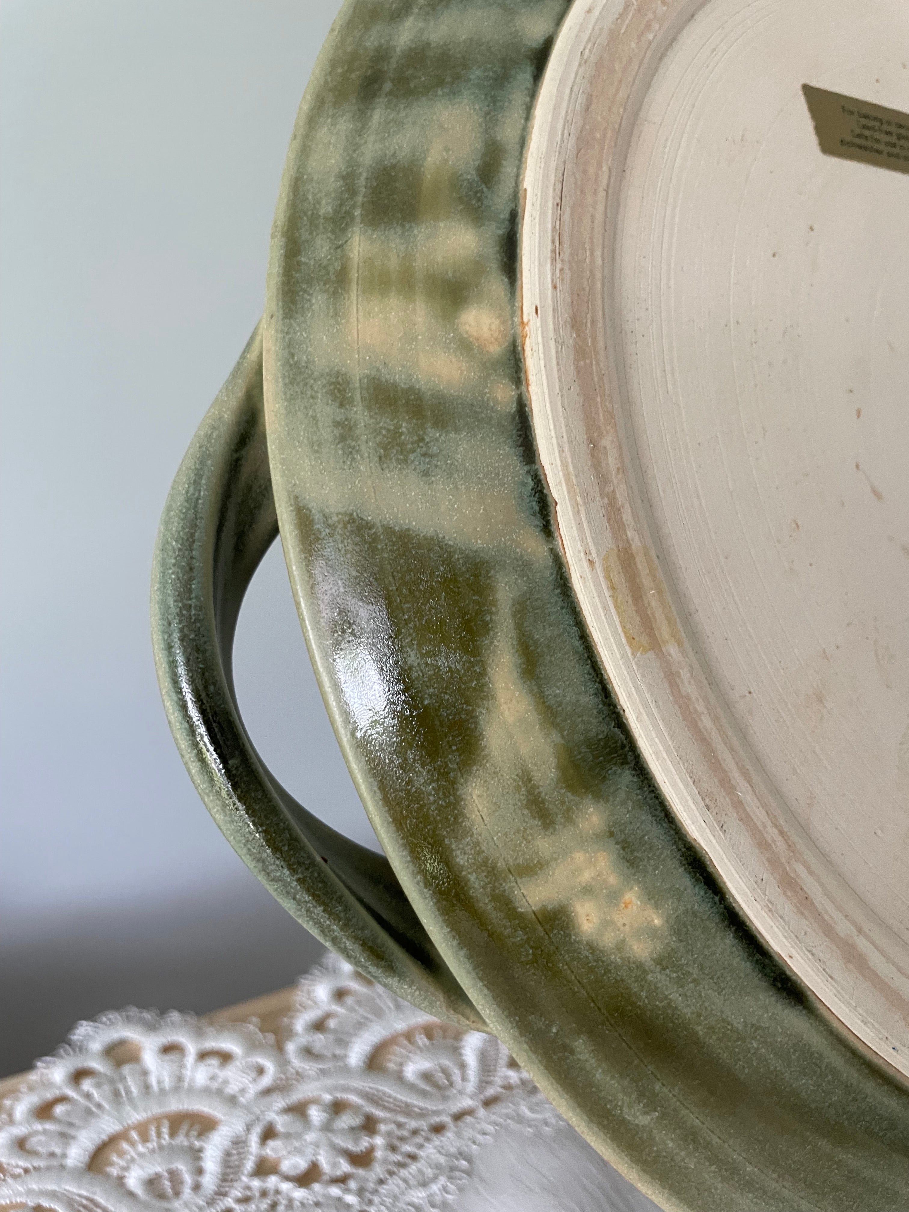 Olive green ceramic tray with sculpted handles