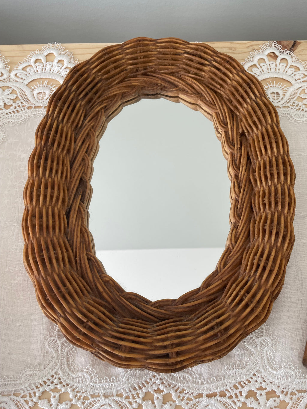 Vintage Rattan framed oval mirror
