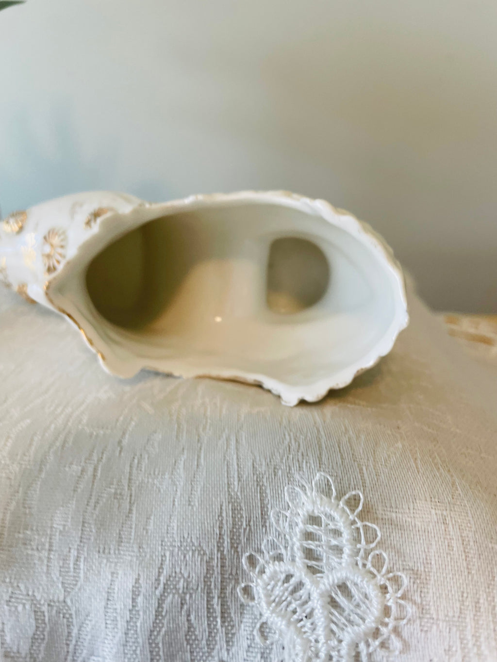 Victorian porcelain shoe with embossed floral and gilded accents