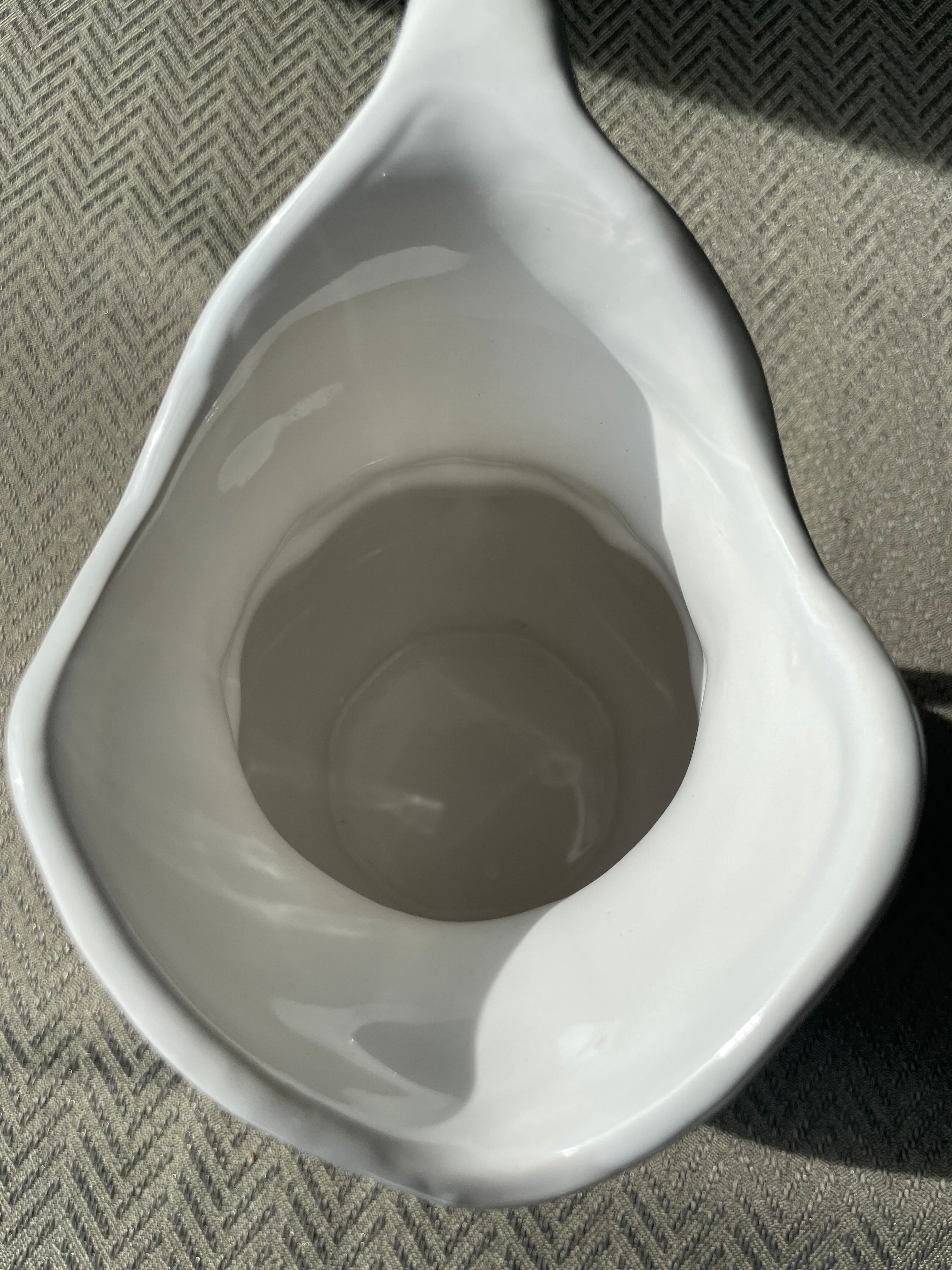 Pfaltzgraff Filigree pattern stoneware pitcher with embossed scrolls