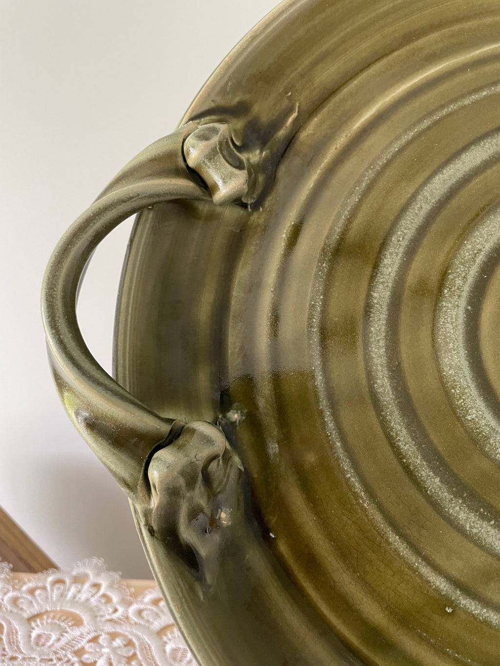 Olive green ceramic tray with sculpted handles