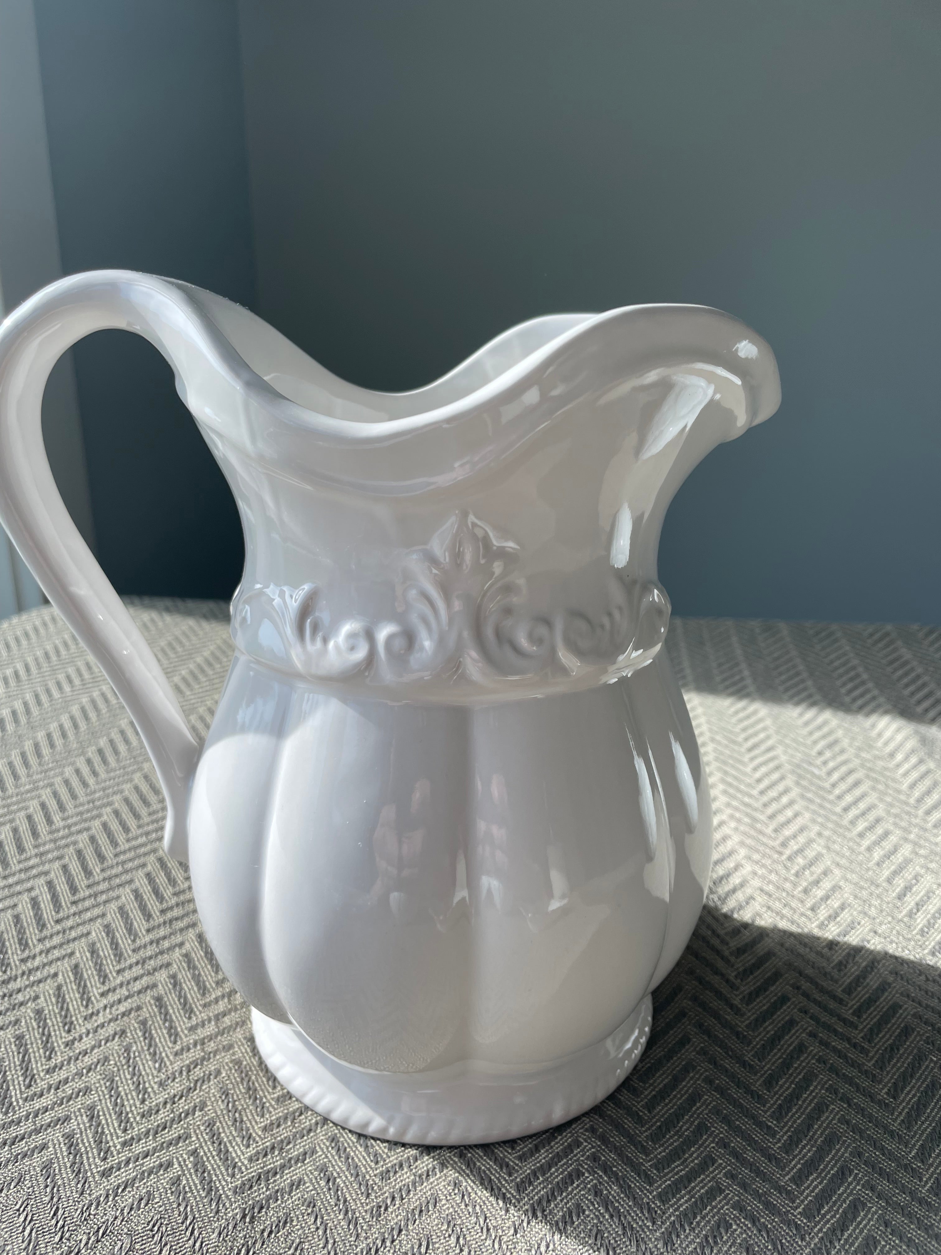Pfaltzgraff Filigree pattern stoneware pitcher with embossed scrolls