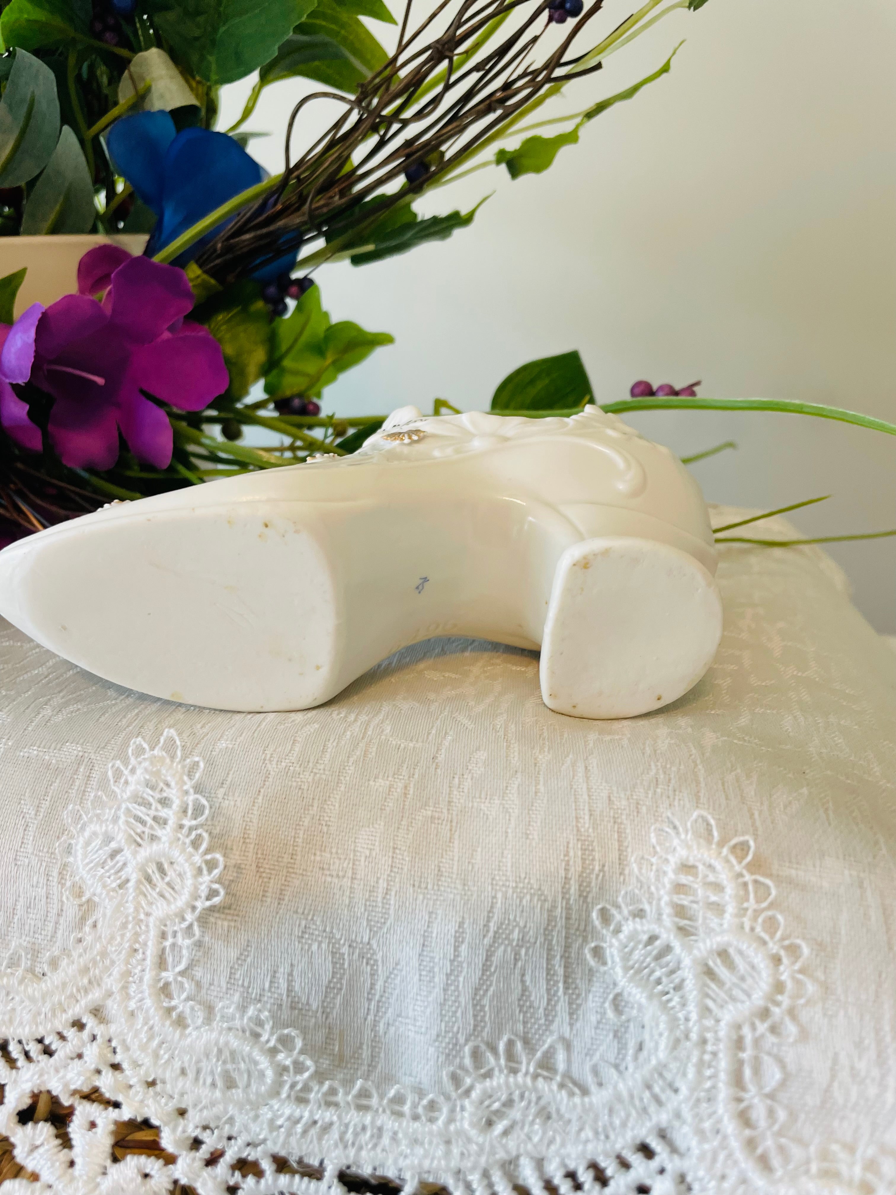 Victorian porcelain shoe with embossed floral and gilded accents